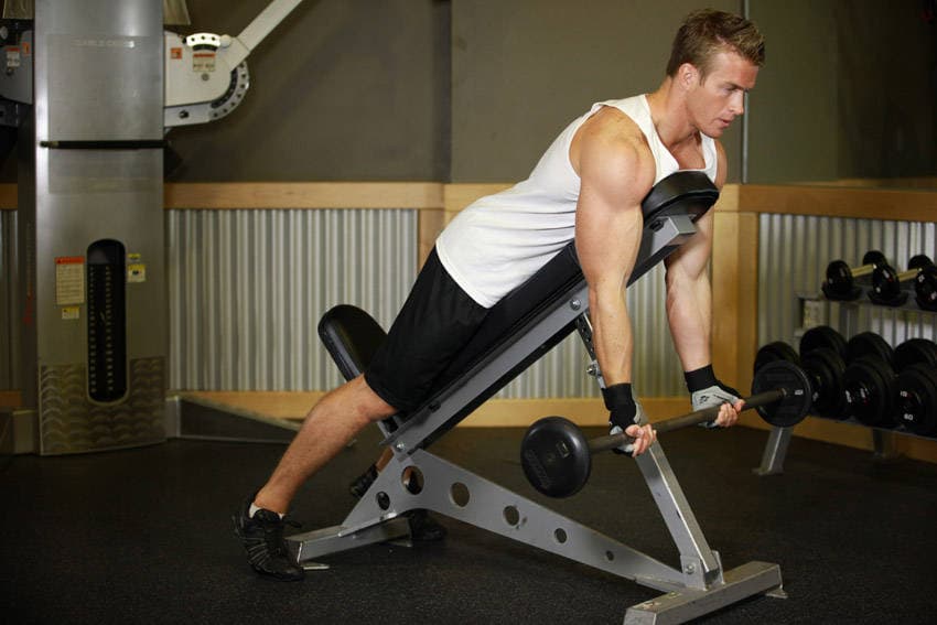 Barbell Curls Lying Against An Incline